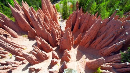 Upper Bolzano - Earth Pyramids - Aerial view from above vertically into the glowing pyramids on the mountainside