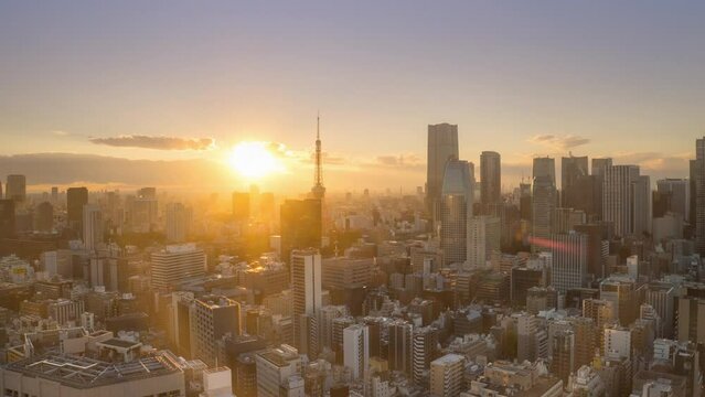 tokyo city downtown aerial view time lapse from day to night,modern metropolis town with high rise buildings timelapse at sunset