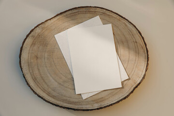 Neutral stationery still life. Blank paper greeting card, invitation mockup with envelope on cut...