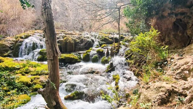 Living Waters: Delving into the Details of Pitarque River's Source in Fortanete, Teruel, through an Astonishing 4K Video Showcasing the Magic of its Waterfalls and the Spectacle of its Steep Canyon