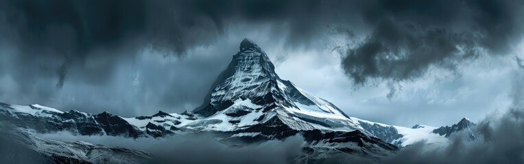 A snowcovered mountain under a cloudy sky, a world of natural landscape