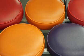 Closeup Round leather sofa - Orange Red Blue color  - Abstract Background 