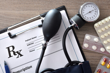 Detail blood pressure medication prescription note with monitor and medications