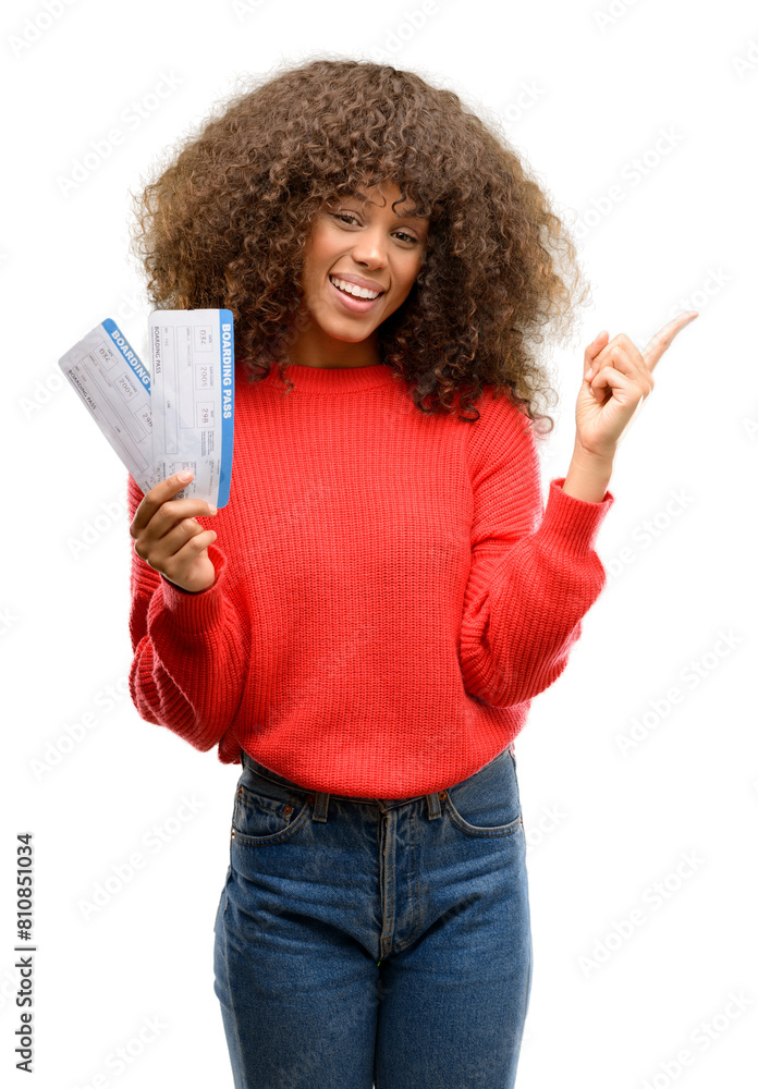 Canvas Prints African american woman holding airline boarding pass tickets very happy pointing with hand and finger to the side