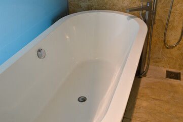The view of the luxurious bathtub in the hotel promises a relaxing and indulgent experience