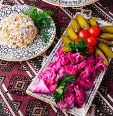 Traditional slavic cuisine assortment on ornate tablecloth