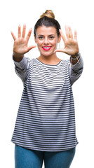 Young beautiful woman casual stripes sweater over isolated background showing and pointing up with fingers number ten while smiling confident and happy.