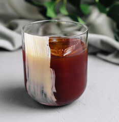 Refreshing iced coffee on modern kitchen counter