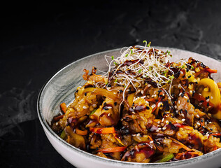 Gourmet stir-fried vegetable dish on elegant plate