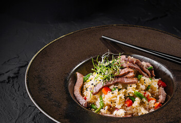 Delectable asian beef fried rice in elegant presentation