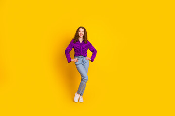 Full length photo of lovely young lady posing model dressed stylish violet garment isolated on yellow color background