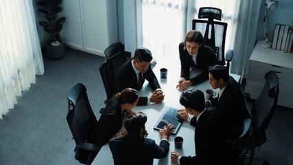 Top view of diverse business team discuss about marketing idea while businessman analyze financial...