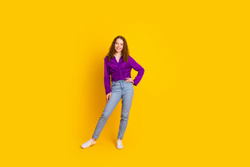 Fototapeta premium Full body photo of pretty young girl posing model wear trendy violet outfit isolated on yellow color background