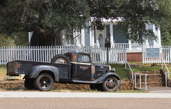 Troup, TX - August 31, 2023: Historic Bed and Breakfast with old truck in downtown Troup, TX