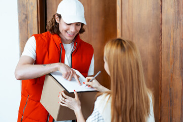 Friendly Courier Delivering Package At Home, Woman Signing Receipt On Clipboard, Customer Service,...