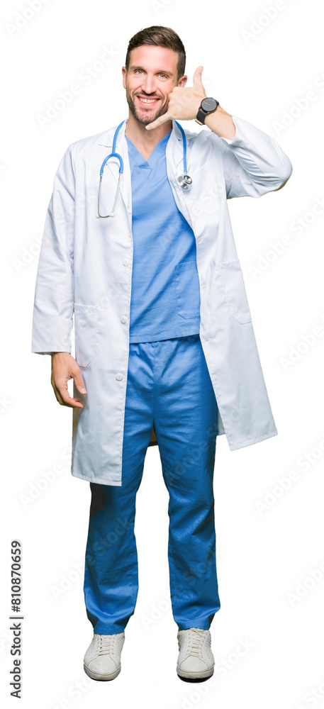 Wall mural Handsome doctor man wearing medical uniform over isolated background smiling doing phone gesture with hand and fingers like talking on the telephone. Communicating concepts.