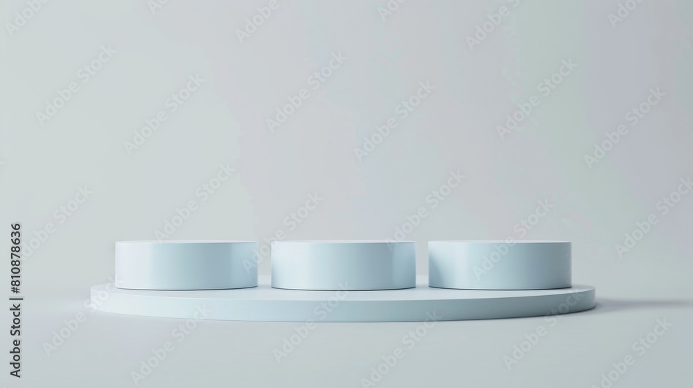 Poster a white pedestal with three white cylinders on it. the cylinders are arranged in a row and are all t