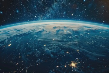 Fototapeta premium A beautiful view of the Earth from space, with the planet's surface illuminated by the stars. The night sky is filled with a multitude of stars, creating a serene and peaceful atmosphere