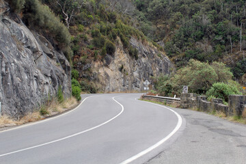 Great Ocean Road winding through mountains in Victoria, Australia