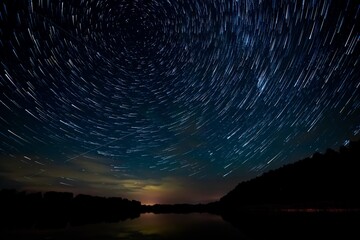 star tracks in the summer sky, star trails, Polaris, northern constellations, by the lake,...