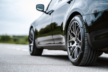 Black car parked on roadside