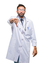 Adult hispanic doctor man over isolated background looking unhappy and angry showing rejection and negative with thumbs down gesture. Bad expression.
