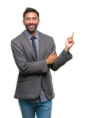 Adult hispanic business man over isolated background with a big smile on face, pointing with hand and finger to the side looking at the camera.