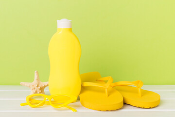 Bright beach accessories on wooden table