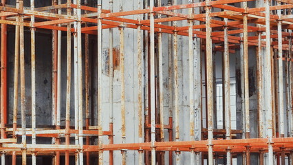 Rusty Metal Scaffolding On Concrete Building Construction