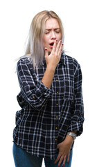 Young blonde woman over isolated background bored yawning tired covering mouth with hand. Restless and sleepiness.