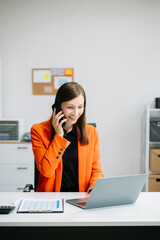 Confident business expert attractive smiling young woman holding digital tablet  on desk