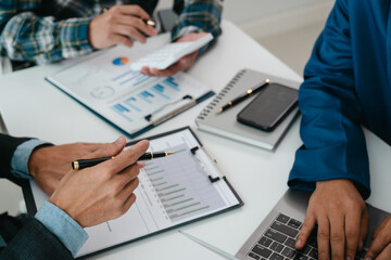 A team of young entrepreneurs and Asian startups held a business meeting. to achieve the marketing plan Businessmen talking in a conference room. Business. Population. Company.