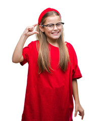 Young beautiful girl wearing glasses over isolated background smiling and confident gesturing with hand doing size sign with fingers while looking and the camera. Measure concept.