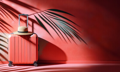 Chic Travel Setup with Red Coral Suitcase and Straw Hat