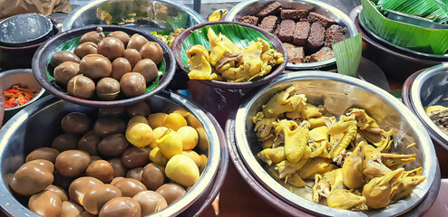 dishes served in Indonesian food Liwet Rice. Traditional javanese Rice Served with Chicken, Tofu, Tempeh, vegetable, Chili, egg