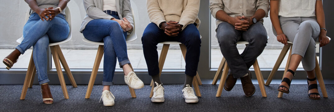 Business people, legs and waiting room with line for interview, career or job opportunity at office. Group of employees, interns or candidates in row on chairs or banner for meeting at workplace