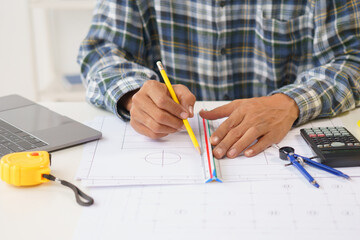 A home architect is reviewing a draft house plan. Projects assigned by customers and customized...