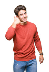 Young handsome man over isolated background smiling doing phone gesture with hand and fingers like talking on the telephone. Communicating concepts.