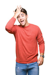 Fototapeta premium Young handsome man over isolated background surprised with hand on head for mistake, remember error. Forgot, bad memory concept.