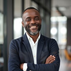 Portrait of an African American male businessman in a suit against the background of an office