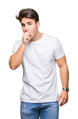 Young handsome man wearing white t-shirt over isolated background feeling unwell and coughing as symptom for cold or bronchitis. Healthcare concept.