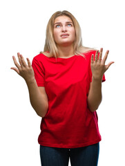 Young caucasian woman over isolated background crazy and mad shouting and yelling with aggressive expression and arms raised. Frustration concept.