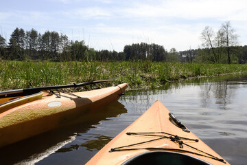 Yellow kayaks on  river.  Summer recreation