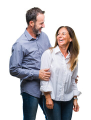Middle age hispanic business couple over isolated background with a happy and cool smile on face....