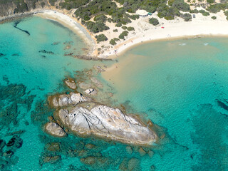 Scoglio di Peppino beach, rock of Peppino aerial view with drone, Costa Rei, Sardinia, Italy