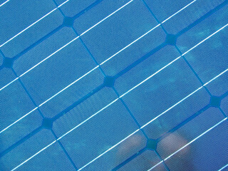 Photovoltaic technology for sustainability, renewable and clean energy. Solar panel background blue panels cells close up.