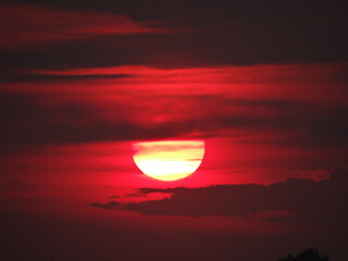 The sun is set  and the clouds on the evening moody orange sky,  amazing nature picture