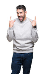 Young handsome man wearing sweatshirt over isolated background shouting with crazy expression doing...