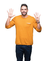 Young handsome man over isolated background showing and pointing up with fingers number nine while smiling confident and happy.