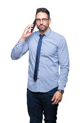 Fototapeta premium Young business man talking on the phone over isolated background with a confident expression on smart face thinking serious